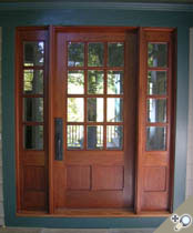 G160 / S12 entrance unit shown in Spanish cedar featuring chamfered stile / rail detail around flat panels. Standard insulated glass shown.